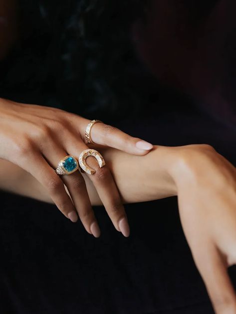 Model wearing Harwell Godfrey rings including the Stardust ring set with a 10.95-carat blue zircon and baguette and round diamonds. (Harwell Godfrey)