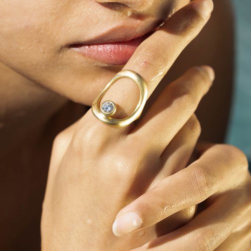 White Space Double Continuity ring with diamond in 14-karat recycled gold on model. (White Space)