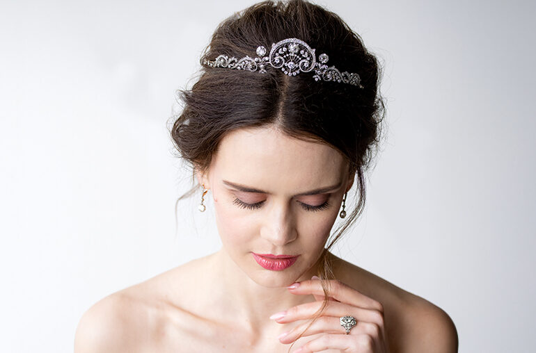 model wearing a French Belle Epoque convertible diamond tiara and antique earrings and ring, all from Lang Antique & Estate Jewelry.