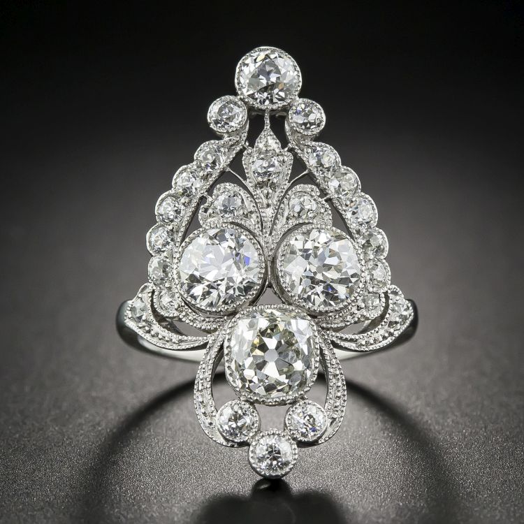 Marcus & Co. Edwardian diamond dinner ring set with a 1.20-carat, antique cushion-cut diamond and 1.55 carats of old mine-cut diamonds, in platinum, circa 1910. (Lang Antique & Estate Jewelry)