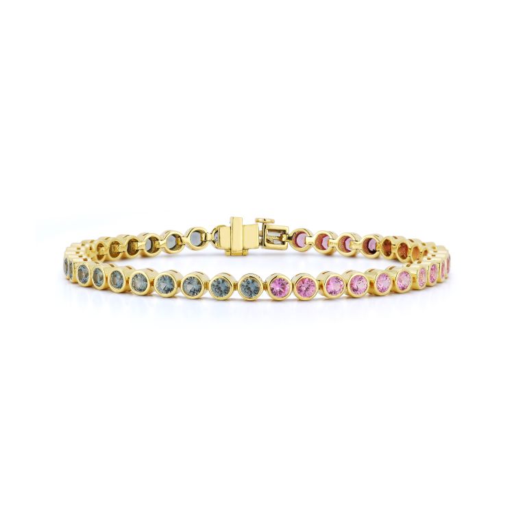 Jemma Wynne Anniversary light pink and grey sapphire tennis bracelet in 18 karat yellow gold. (Jemma Wynne)