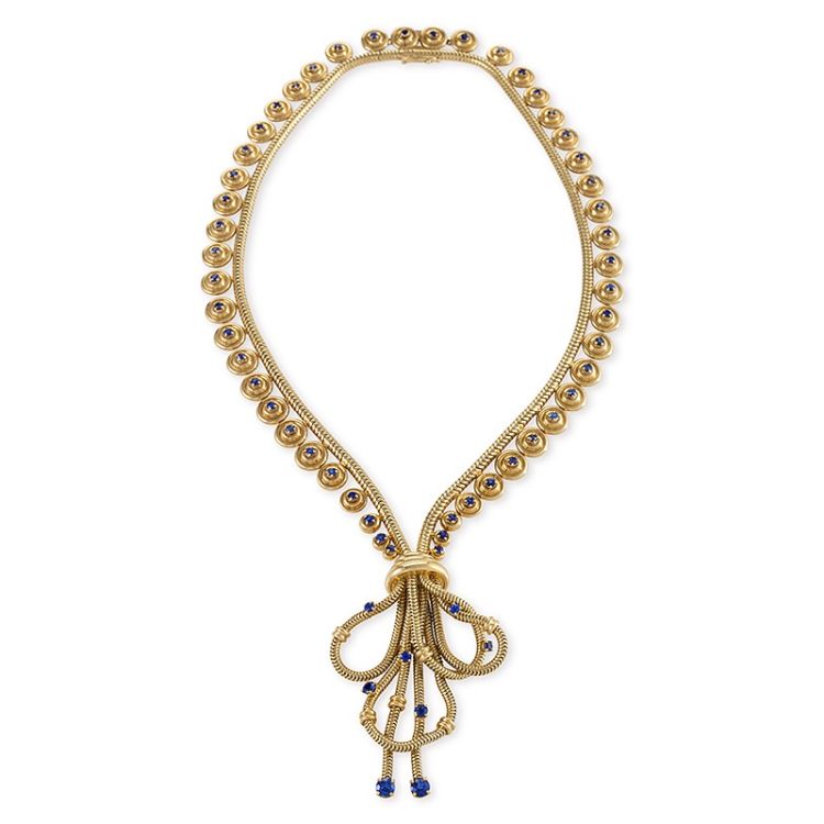 Boucheron 18-karat gold necklace with sapphires, ca. 1940s. The necklace is designed in a modified zipper motif of gold snake chain with 57 round-set sapphires with a snake chain pendant. From the Macklowe Gallery. (Macklowe Gallery)