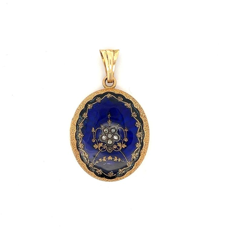 Antique Victorian locket pendant in 14 karat yellow gold and blue enamel. (Filigree Jewelers)