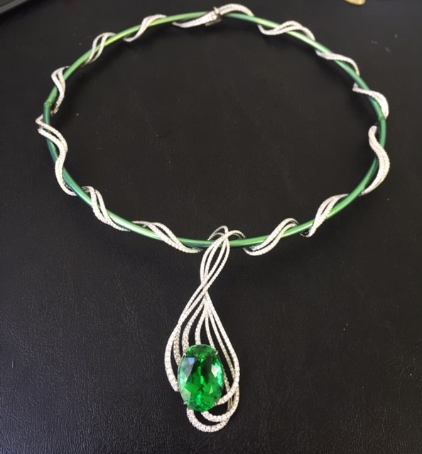 Adam Neely titanium and white gold collar necklace set with a 17-carat copper-bearing green tourmaline from the Campbell Bridges Collection and diamonds. (Campbell Bridges Collection)