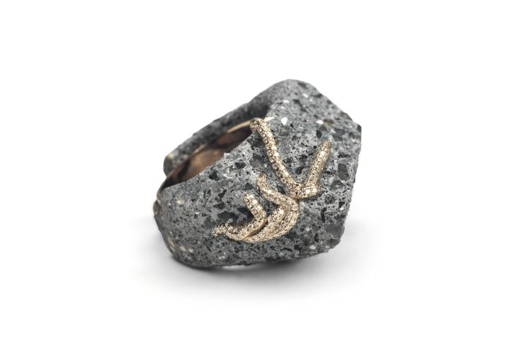 Strangler ring in acid-treated concrete reinforced with blackened 18-karat grey gold and brilliant-cut diamonds. (Studio Renn)