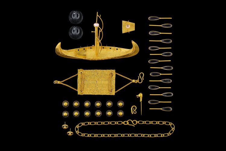 Loren Nicole 22-karat yellow gold and rock crystal Viking Longship shown as it comes apart into more than 30 pieces that can be worn as jewelry in various combinations. (Loren Nicole)