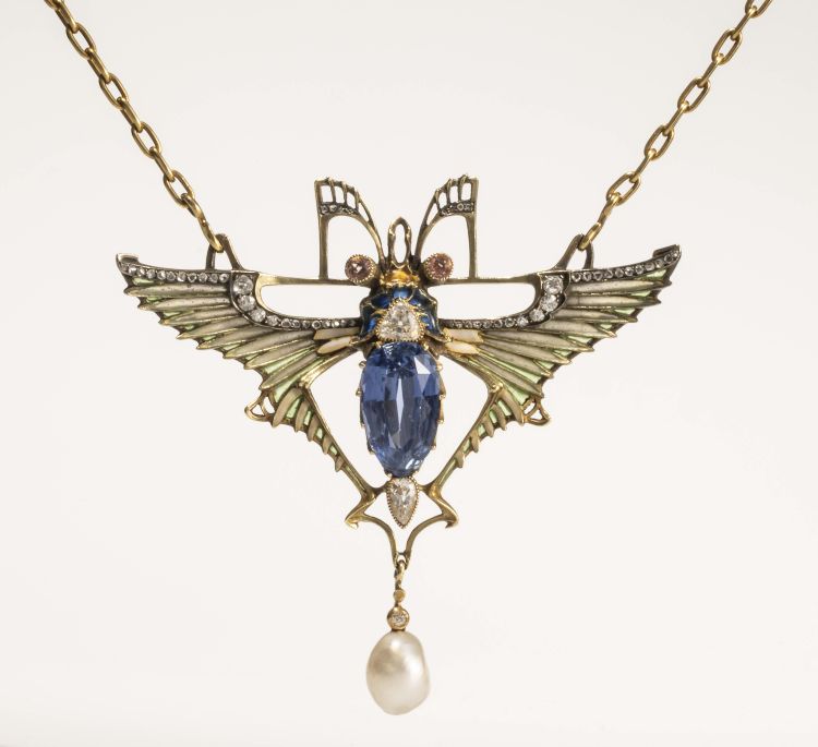Lucien Gautrait Egyptian Revival scarab brooch set in plique-a-jour enamel, sapphire, diamond, and pearl with chain by Léon Gariod, c. 1899-1900. (The Richard H. Driehaus Collection)